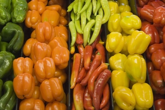 Vegetables stacked on supermarket shelf