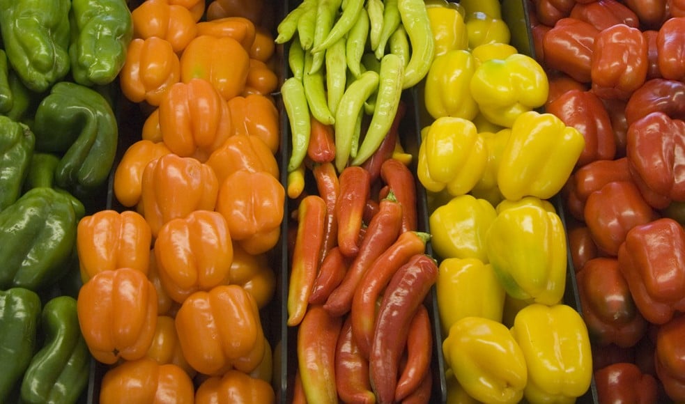 Vegetables stacked on supermarket shelf