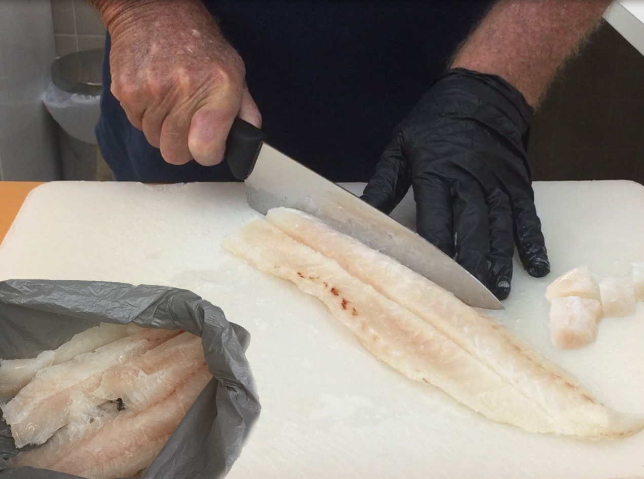 Person cutting a fish