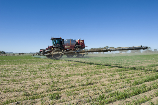 Self propelled boom sprayer in field