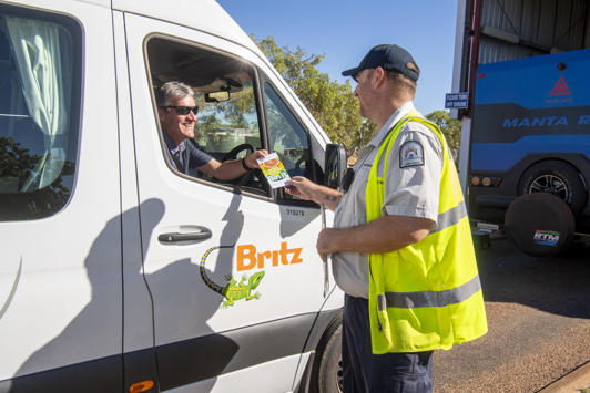 Quarantine WA border inspector taking to driver at Kimberley checkpoint