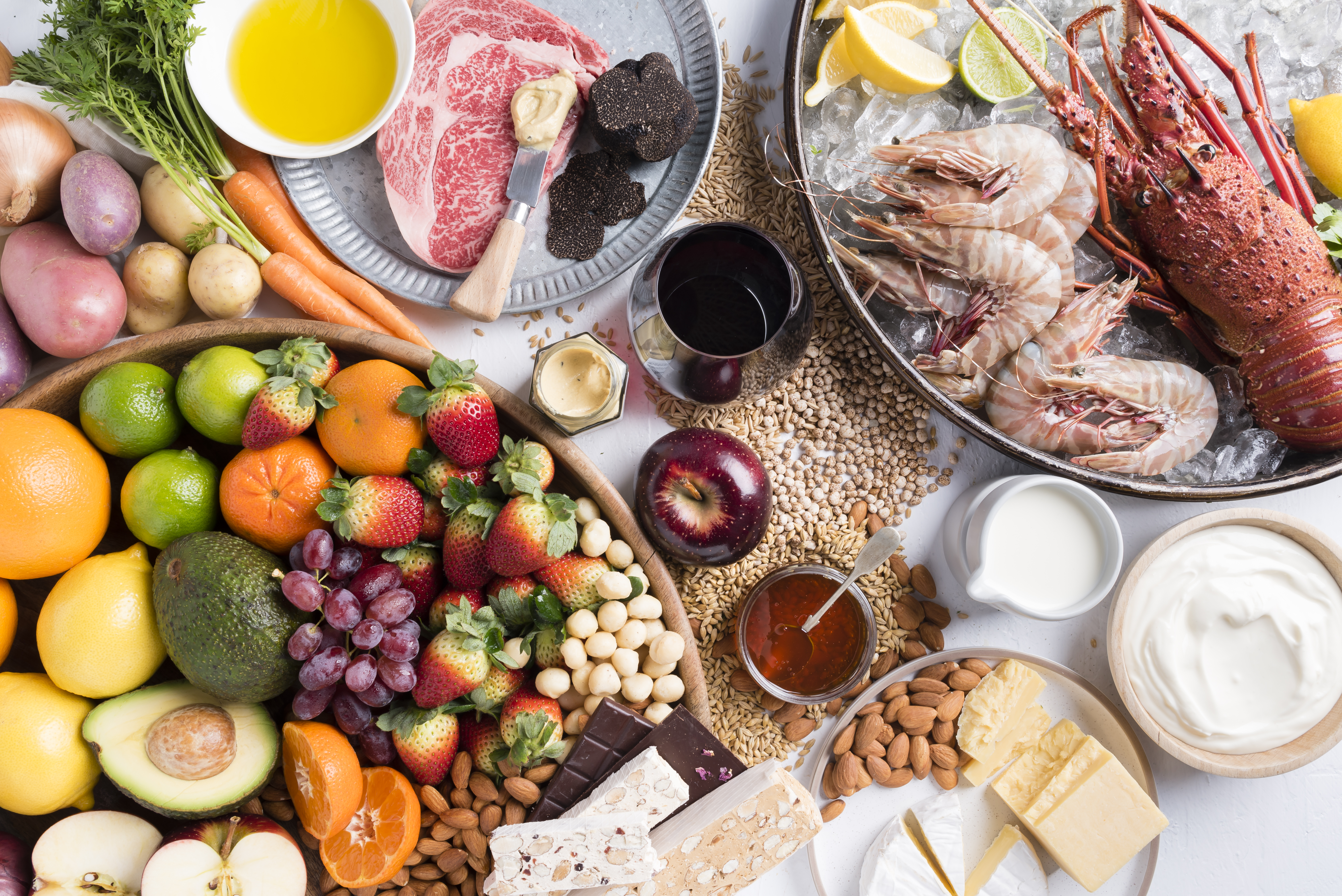 An image of a variety of WA food and beverage such as meat, seafood, fruit, wine and cheese