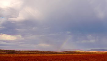 Rainstorm with dark clouds and a rainbow