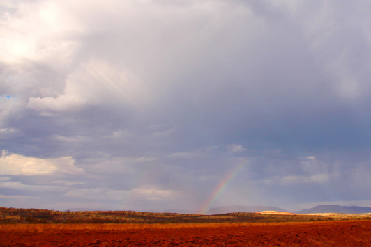 Rainstorm with dark clouds and a rainbow