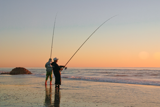 Two people beach fishing