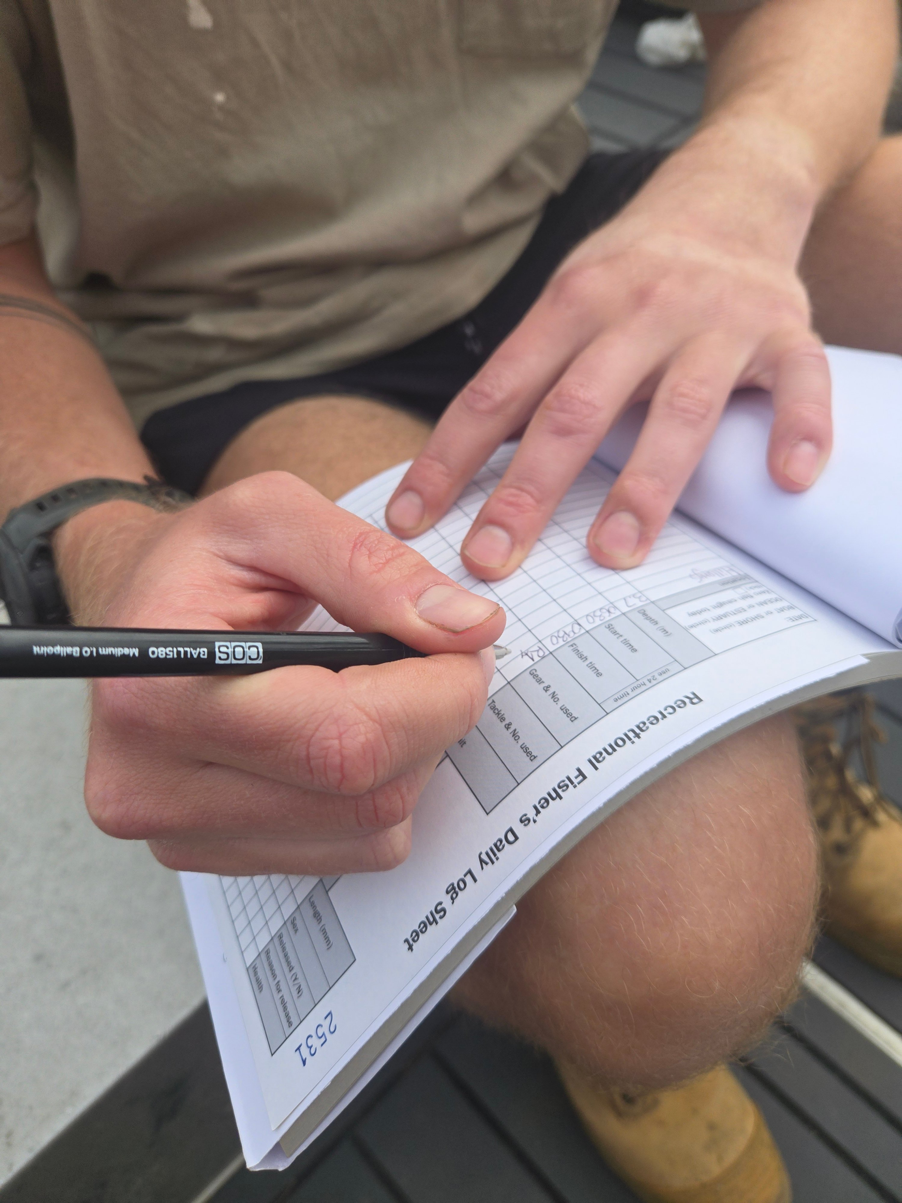 Logbook being filled out
